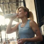 Woman Drinking Beverage Gym